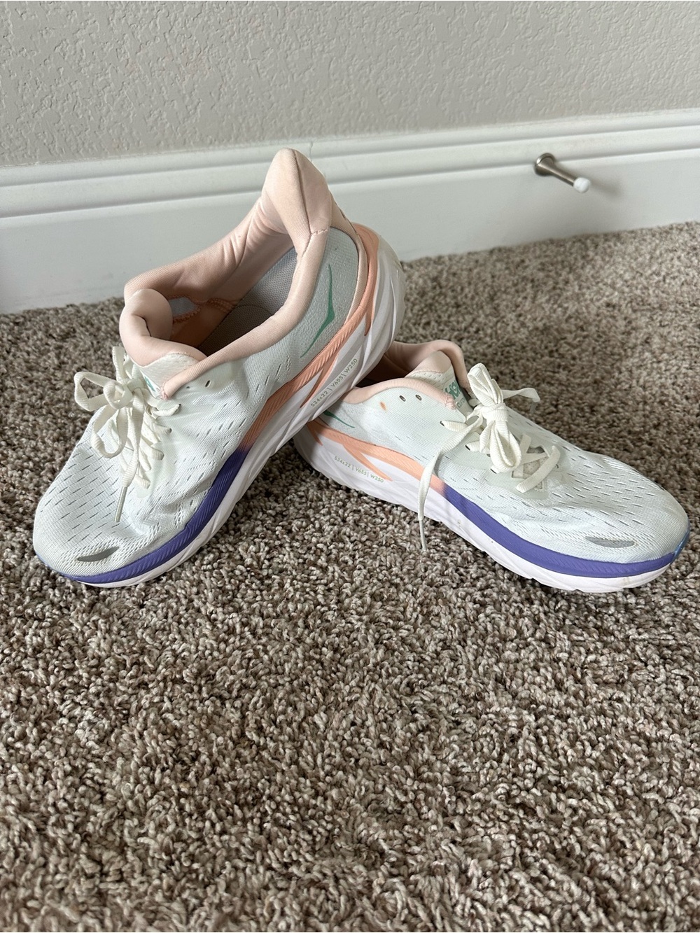 Hoka Women's White Running Shoes with Peach and Lavender Accents
